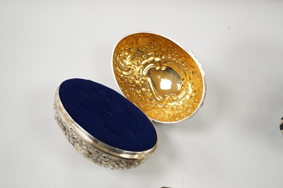 A George V engraved silver rectangular tea caddy, by Nathan & Hayes, Chester, 1913, 81mm, together with an Edwardian repousse silver mounted ring box by Nathan & Hayes, Chester, 1905, a Scottish silver and tortoiseshell